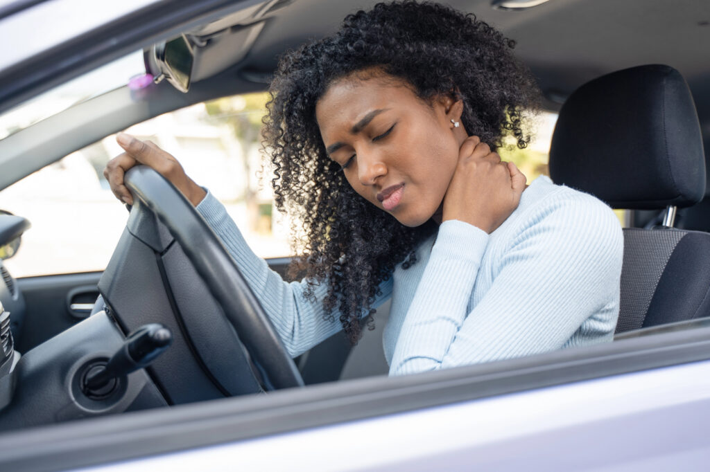 Woman holding her neck in pain after a St. Louis car accident
